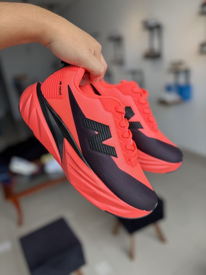 Tênis New Balance Rebel V5 Laranja Premium
